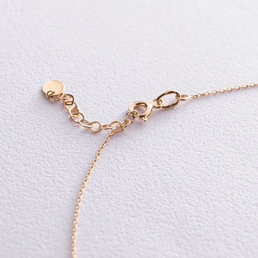 Złoty podwójny naszyjnik z krzyżykiem i kulką – elegancka biżuteria warstwowa