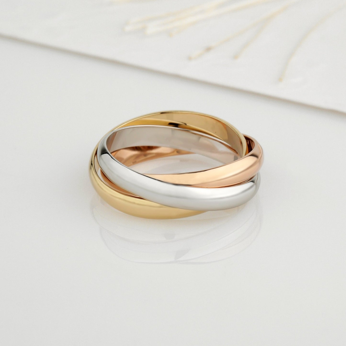 Złoty pierścionek z blokadą. Pierścionek potrójny. Potrójna złota obrączka. Trzykolorowy pierścionek. Pierścionek rocznicowy. Damska obrączka ślubna. Złoty pierścionek damski. Unikalna obrączka ślubna. Trinity Cartier.