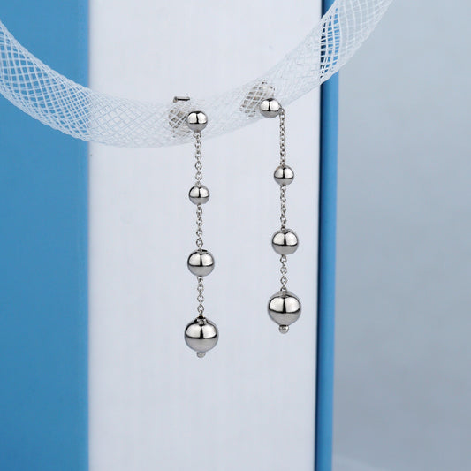 Długie złote kolczyki wiszące z łańcuszkami 585. Eleganckie złote kolczyki wiszące z łańcuszkami 585.