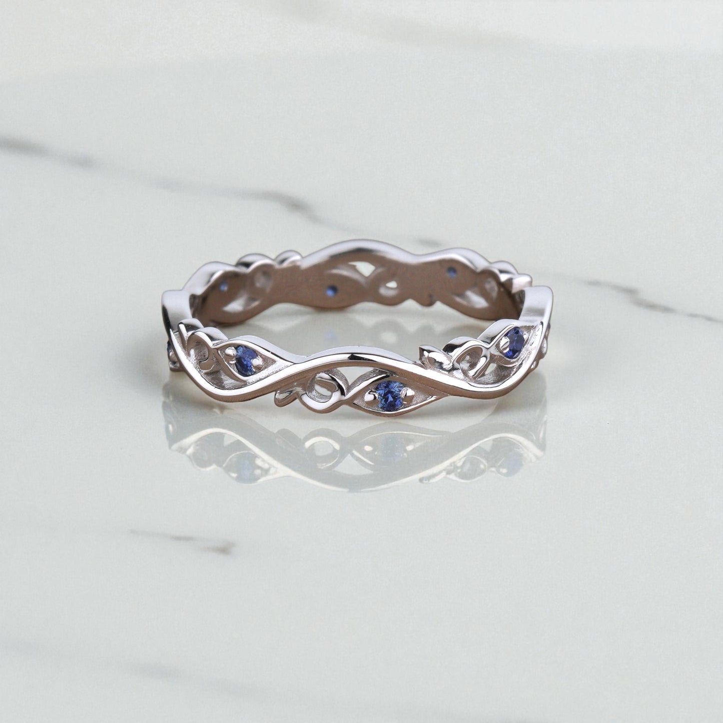 Złota obrączka z szafirami i motywem kwiatowym 426 - 2