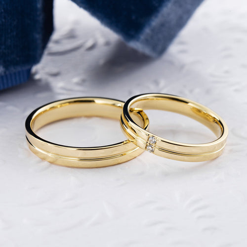 Zestaw obrączek ślubnych dla niego i dla niej. Obrączki dla par. Obrączki ślubne z litego złota. Złote obrączki ślubne z diamentami.