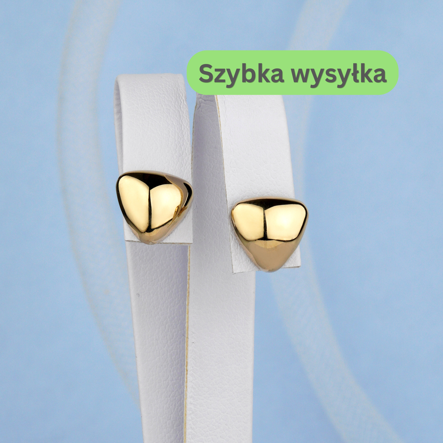Eleganckie złote kolczyki trójkątne z połyskiem – nowoczesna minimalistyczna biżuteria.